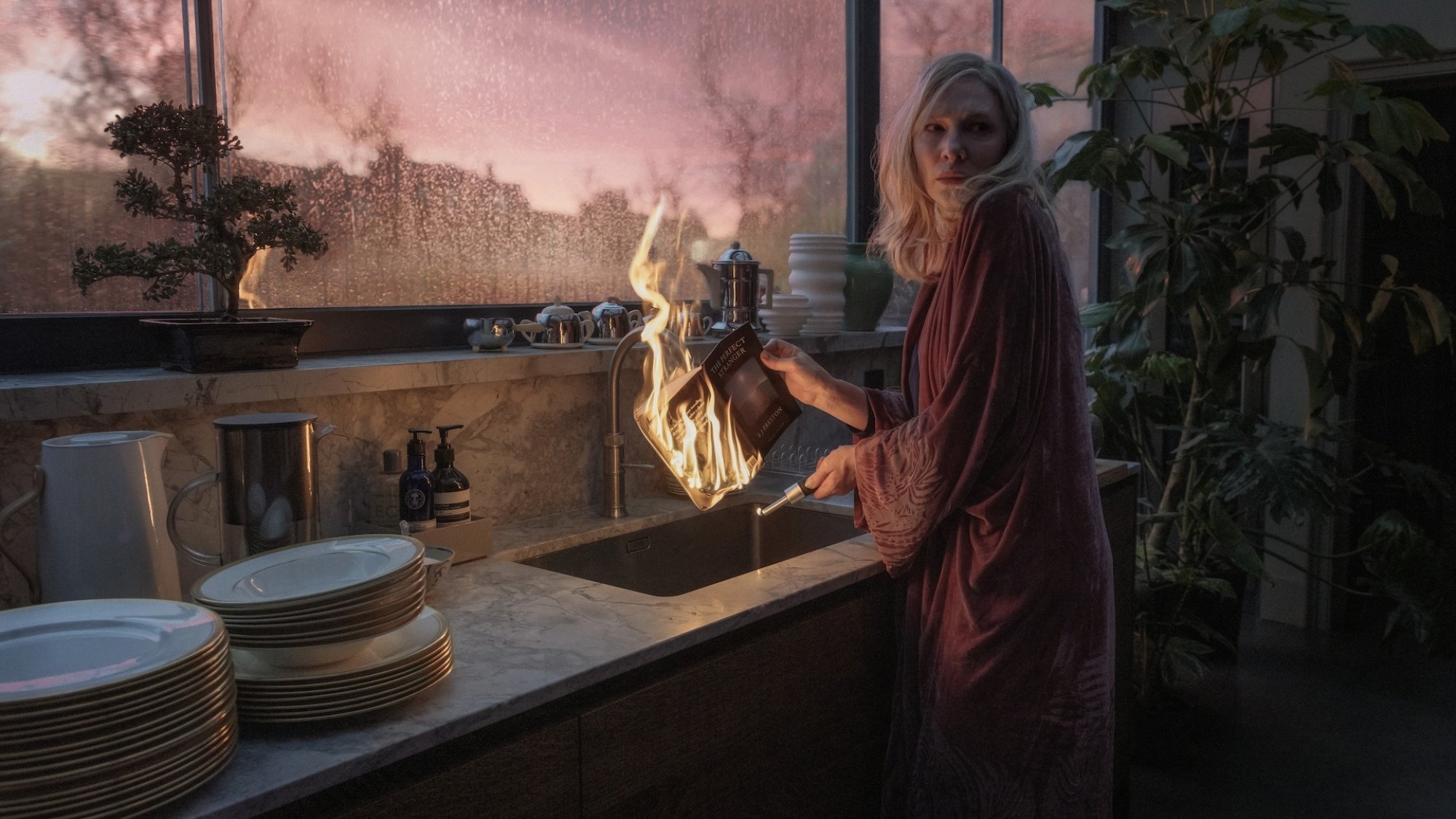 Cate Blanchett burns a piece of paper at the sink in "Disclaimer."