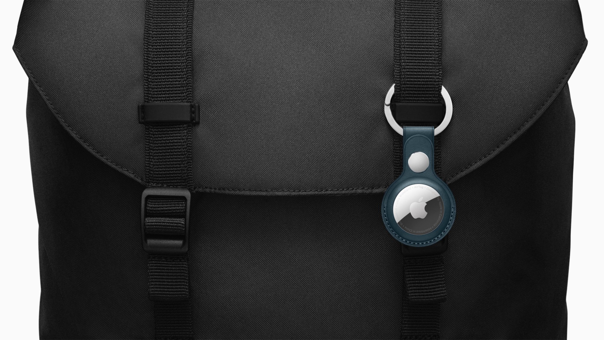 apple airtag on black bag