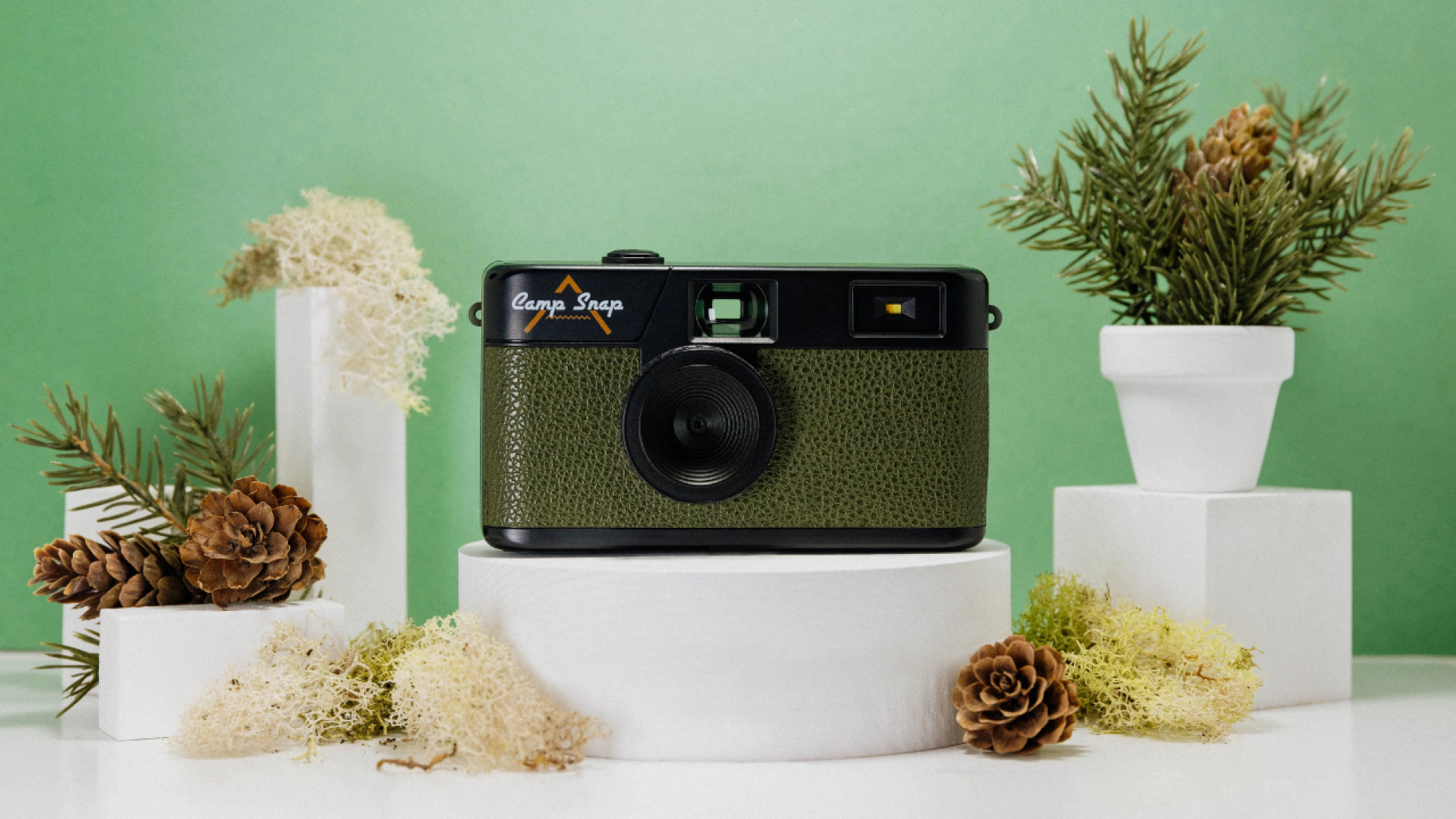 forest green camera against green backdrop