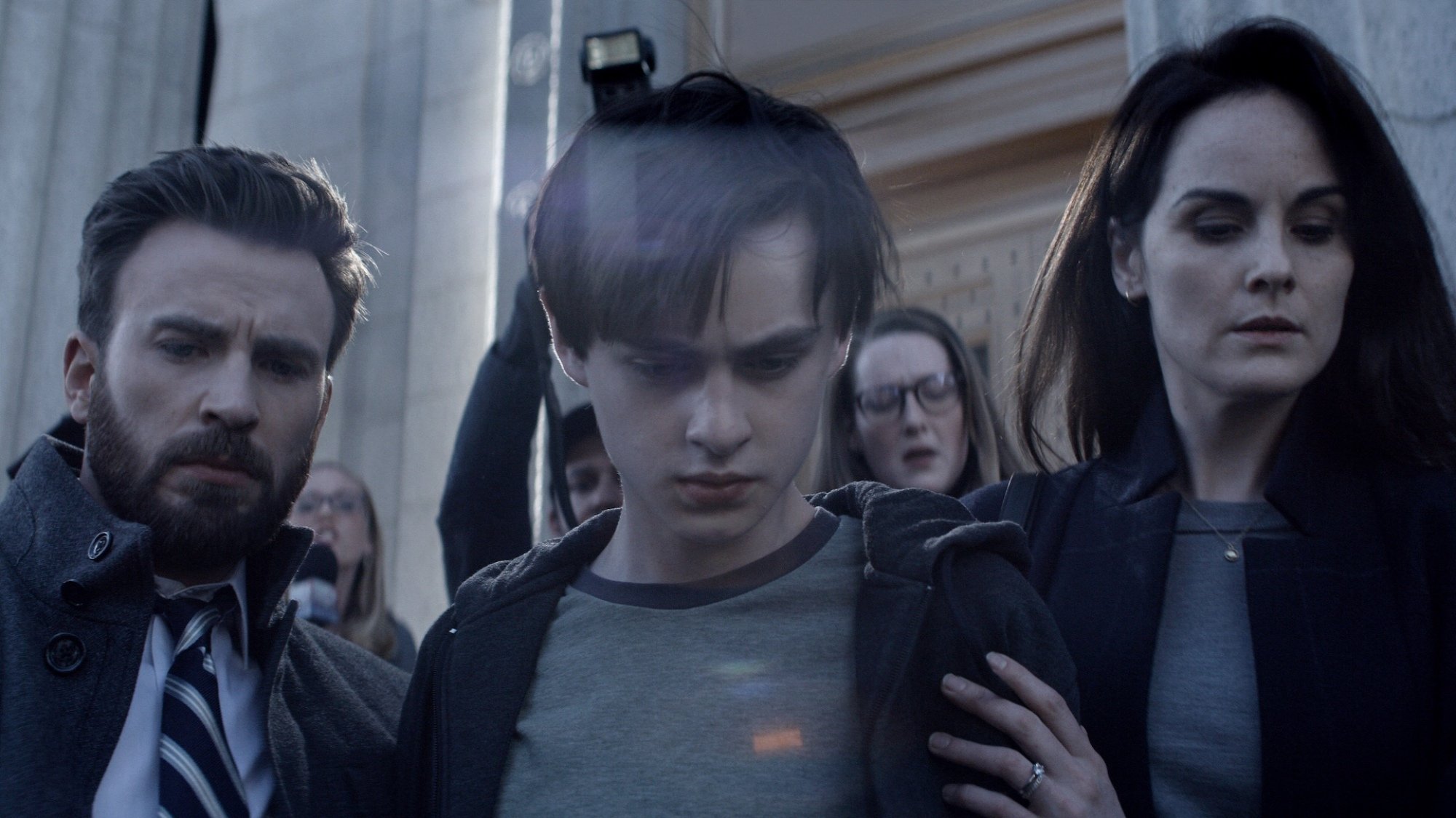 Chris Evans, Jaeden Martell, and Michelle Dockery in “Defending Jacob."