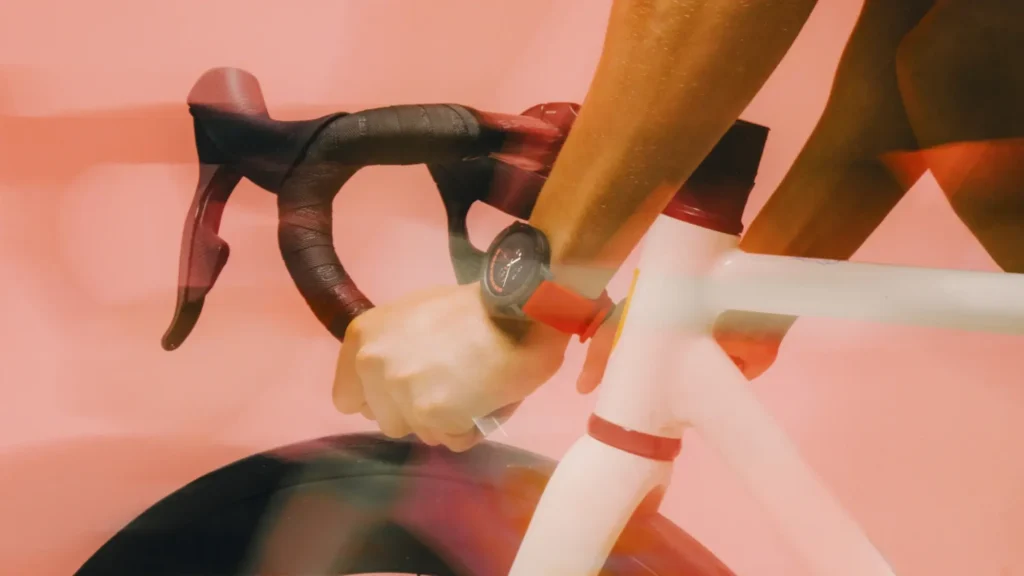 Two people wearing the Nothing CMF Watch Pro 3 while exercising