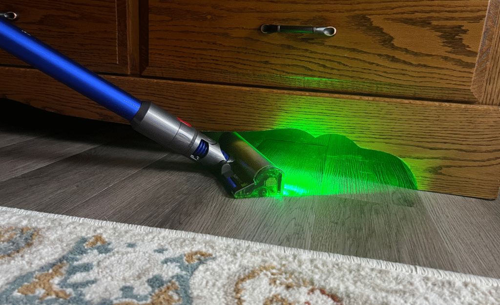 Side by side image of person cleaning floor with Shark and Dyson vacuums