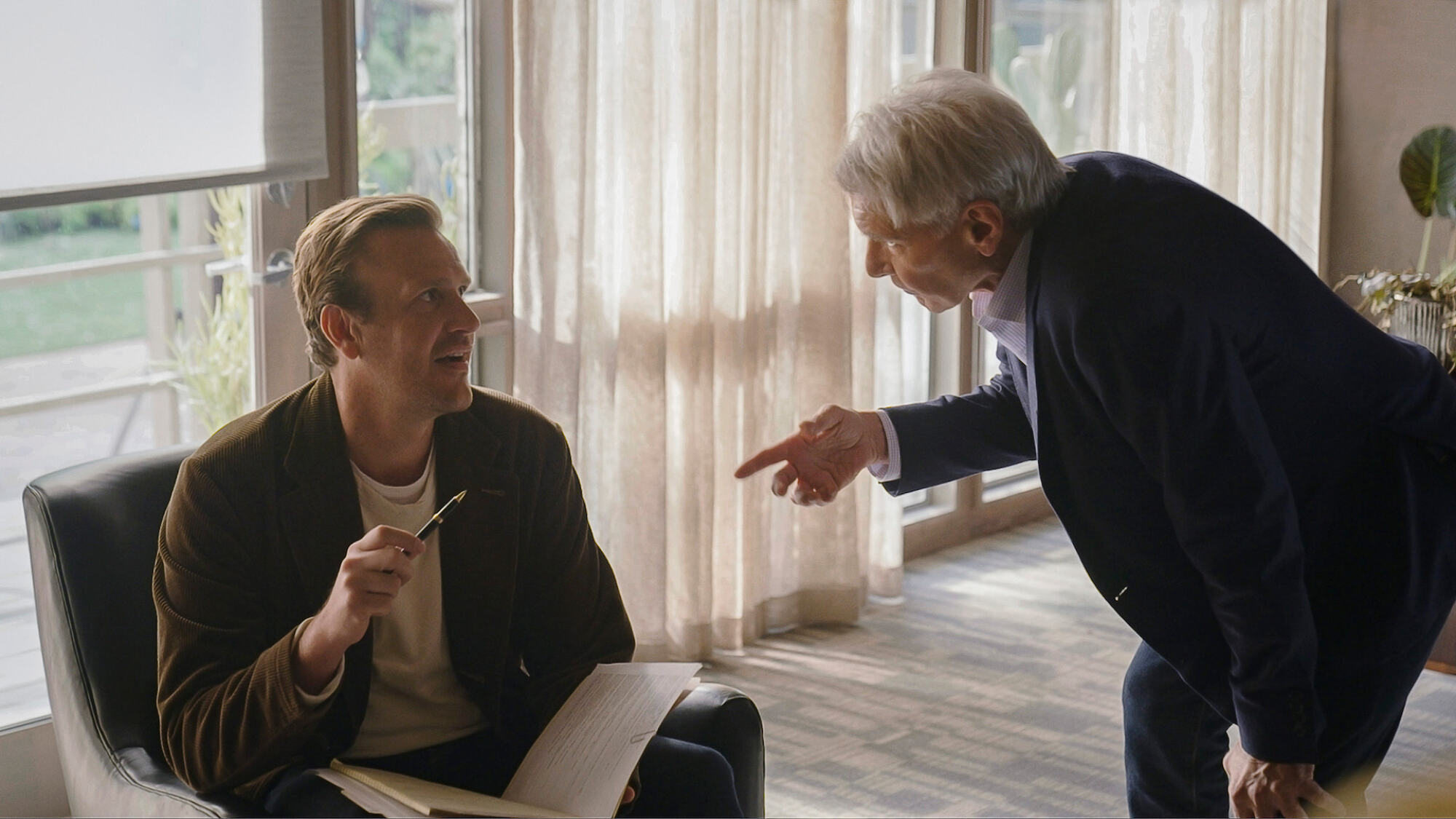 Jason Segel and Harrison Ford argue in a therapist's office in "Shrinking."