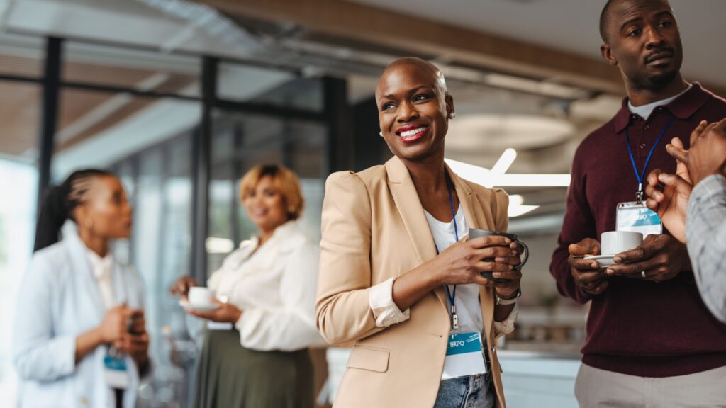 Cheerful business professionals engaging during a conference