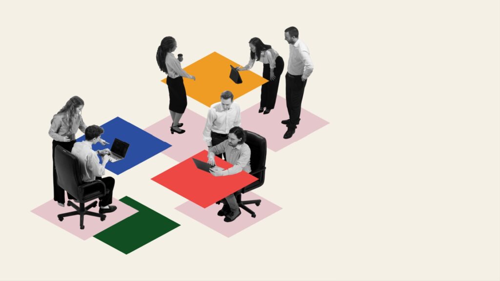 Employees sitting at different tables, cooperating with each other