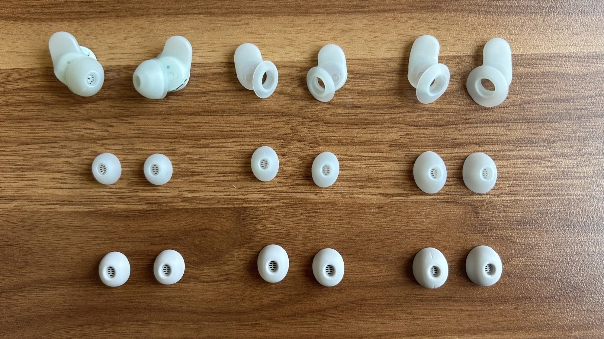 Sleep A30 earbuds with all ear tips and wings on desk